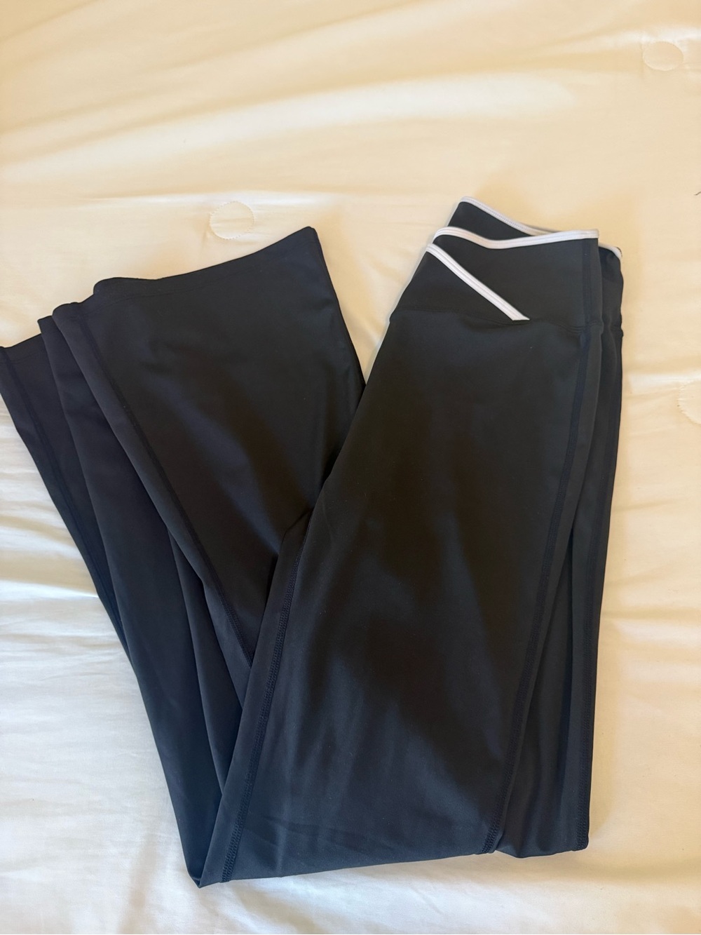 Black leggings with criss cross white line at top